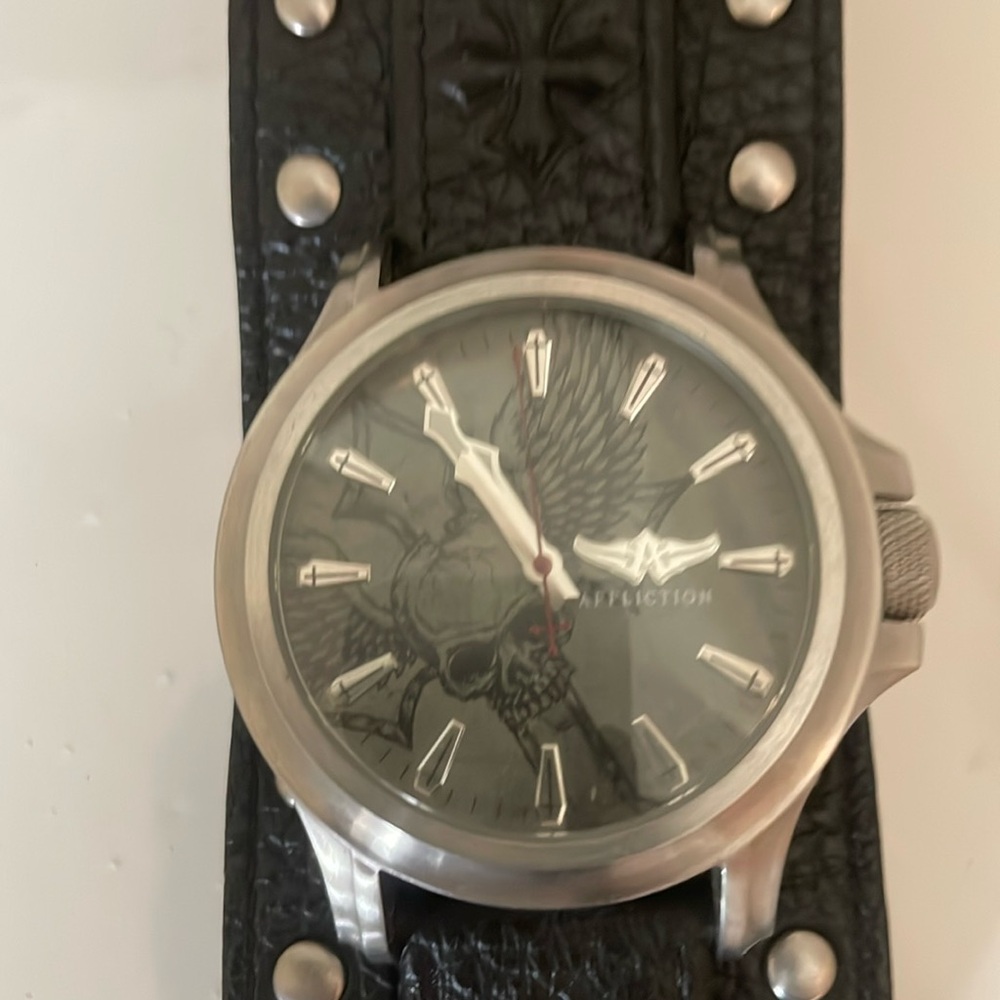 Affliction skull watch.